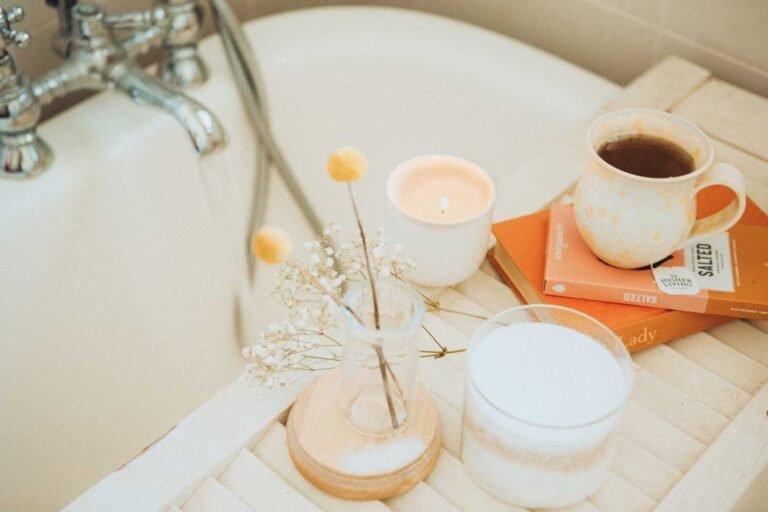 Cozy bathtub scene with coffee and candle representing Self Care for Christian Moms.