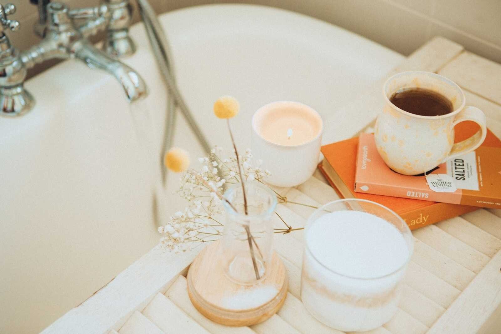 Cozy bathtub scene with coffee and candle representing Self Care for Christian Moms.
