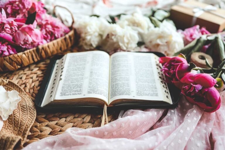 Open Bible surrounded by flowers and soft fabrics, styled for Bible Study for Moms.