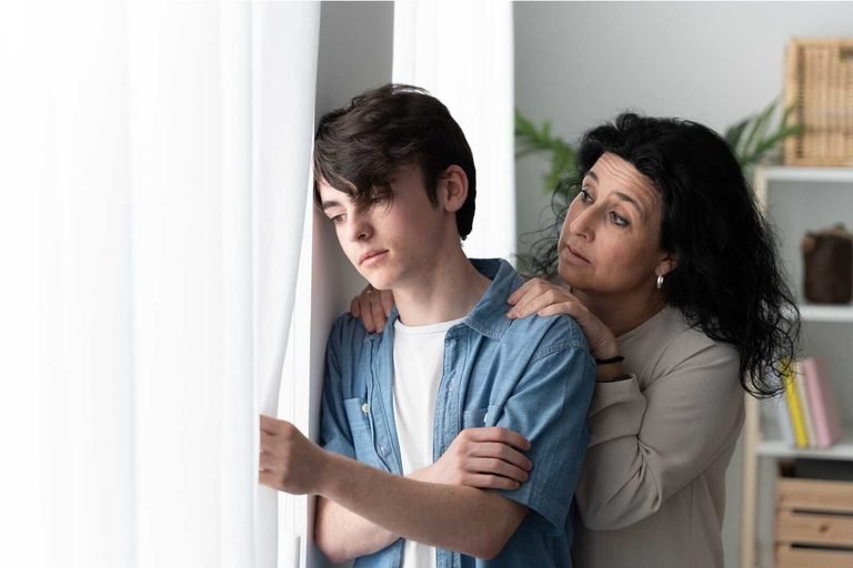 Disrespectful teenager arguing with a parent at home.